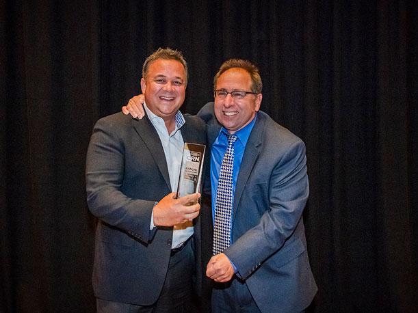 Curtiz Gangi, Vice President of North America Mid-Market Sales,
        accepted the award from CRN Executive Editor, News, Steve Burke.